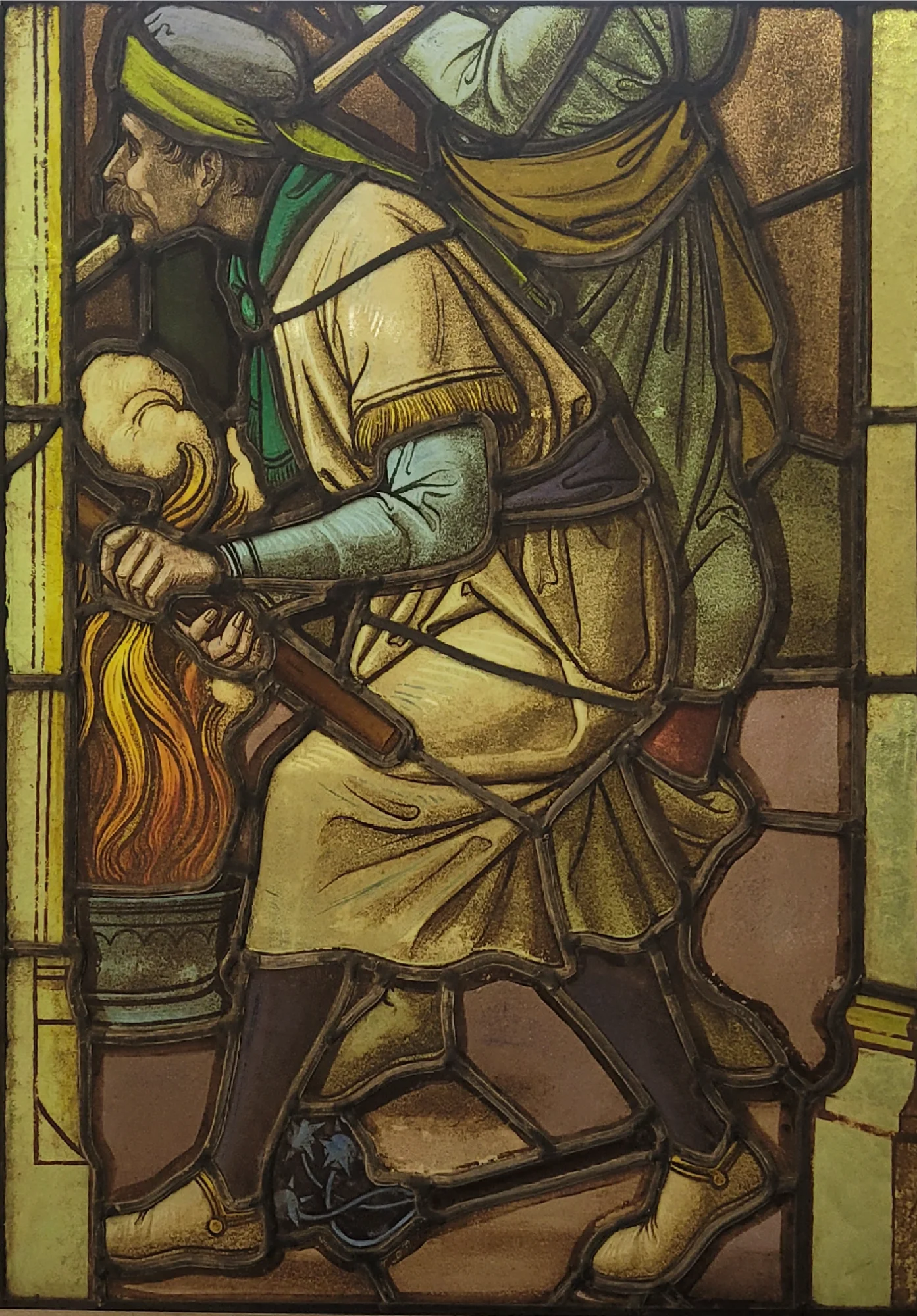 Kerkraam smid bij het vuur